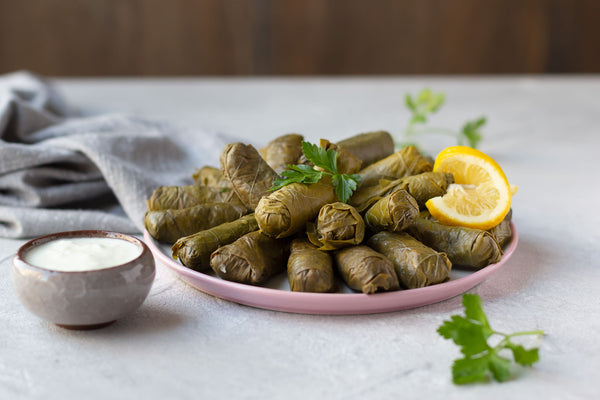 Stuffed Vine Leaves with Sour Grape Sauce